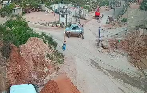 Thumbnail preview image for the video titled: Settlers are preventing a cement quarry from operating by invading it and threatening the workers on a daily basis