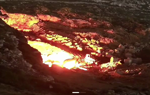Thumbnail preview image for the video titled: Israeli settlers set fire to heavy machinery at a quarry in the town of Sa’ir, north of Hebron