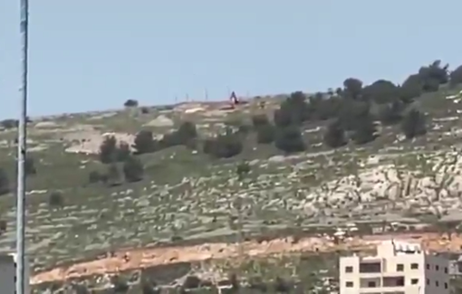 Thumbnail preview image for the video titled: Settlers, under the protection of occupation forces, continue bulldozing the summit of Mount Ebal in Nablus
