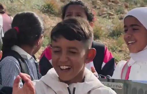 Thumbnail preview image for the video titled: Students from the village of Umm al-Khair stood before a road blocked by Israeli forces, singing in a symbolic act of defiance